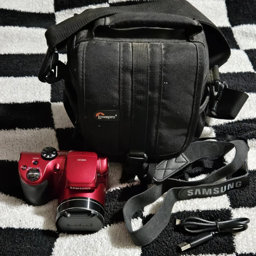 Samsung Wb100 Digital camera 16.1mp, strap, cord, and camera bag